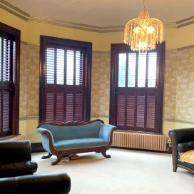 Dark wood tier on tier shutters