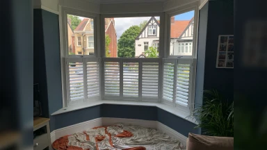 Tall cafe style shutters in a living room