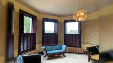 Mahogany tier on tier window shutters half open