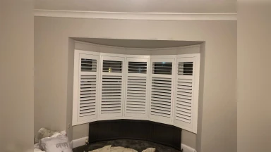 Bay window shutter at night fitted in Sheffield