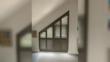 Roof angled window shaped shutter