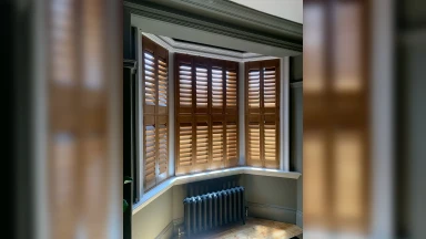 Wooden tier on tier window shutters