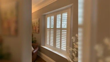 Full height shutters in a living room