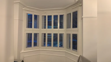 Tier on tier window shutters showing night sky through it in Sheffield