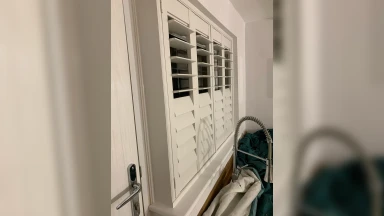 Half open half closed full height window shutter in Kitchen