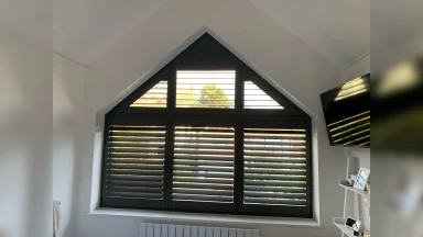 Triangular shaped bathroom window shutter
