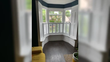 Cafe style shutters fitted in a bay window