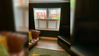Cae style shutters fitted in a wide window